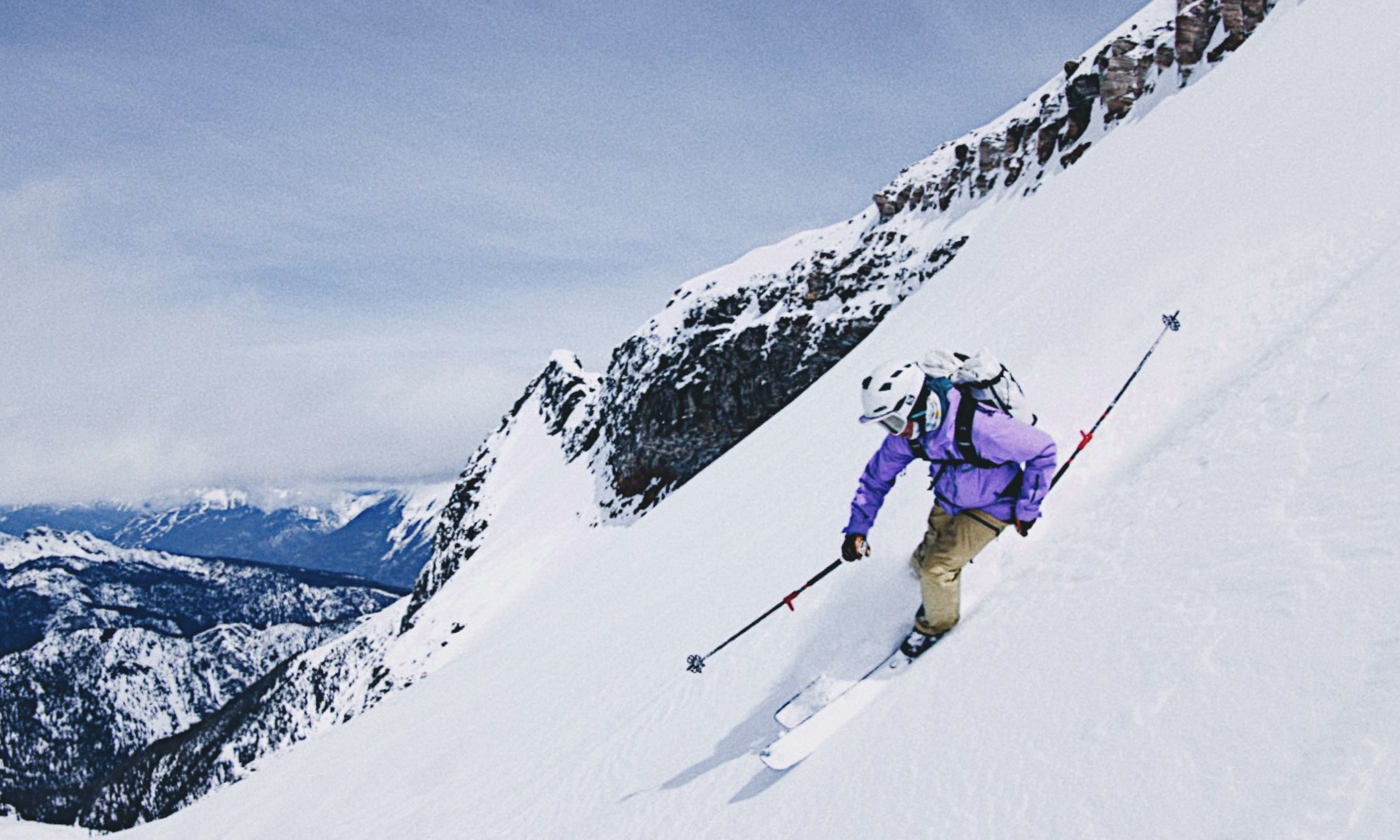 shane robinson spring skiing in the Le Skieur Anorak in purps